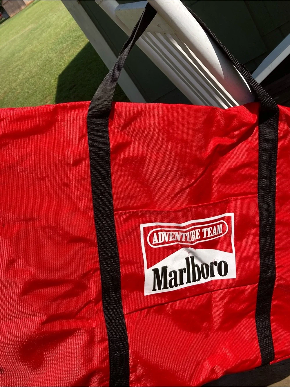 Marlboro Red Duffel with Black Web Handles and Adventure Team Logo